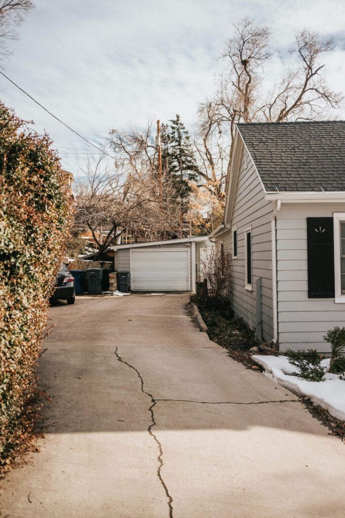 Exterior view of residential driveway and detached garage at a property in Lancaster.